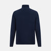 View 3 of product The Turnbull & Asser Navy Fine Merino High Neck Jumper, a plain long-sleeved piece crafted from premium merino wool, is shown on a white background.