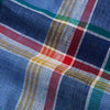 View 4 of product The Blue Multi Check Linen Weekend Fit Suffolk Shirt by Turnbull & Asser features a classic collar, white buttons, chest pocket, and colorful blue, green, yellow, red, and white plaid—perfect for a casual weekend look.