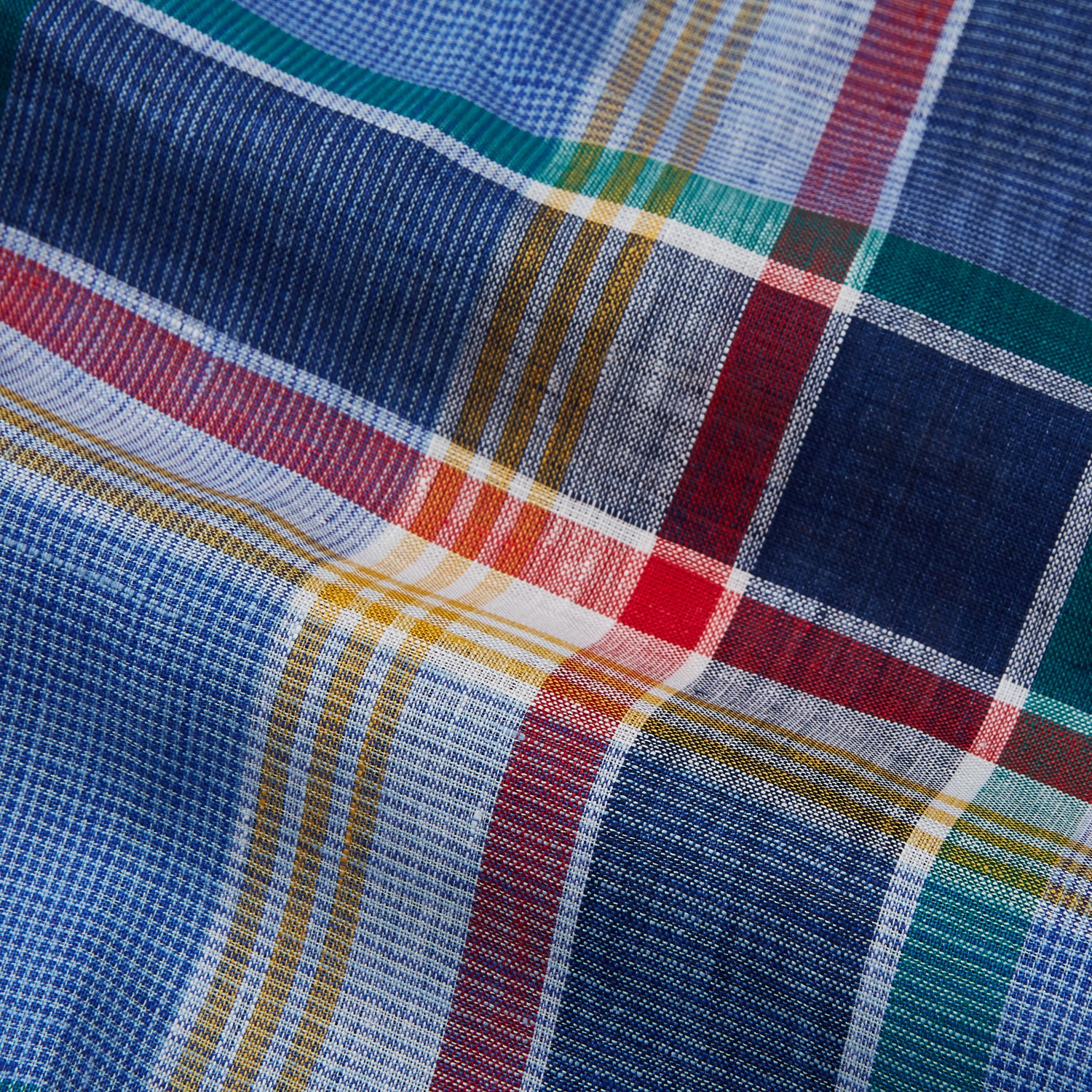 View 4 of product The Blue Multi Check Linen Weekend Fit Suffolk Shirt by Turnbull & Asser features a classic collar, white buttons, chest pocket, and colorful blue, green, yellow, red, and white plaid—perfect for a casual weekend look.