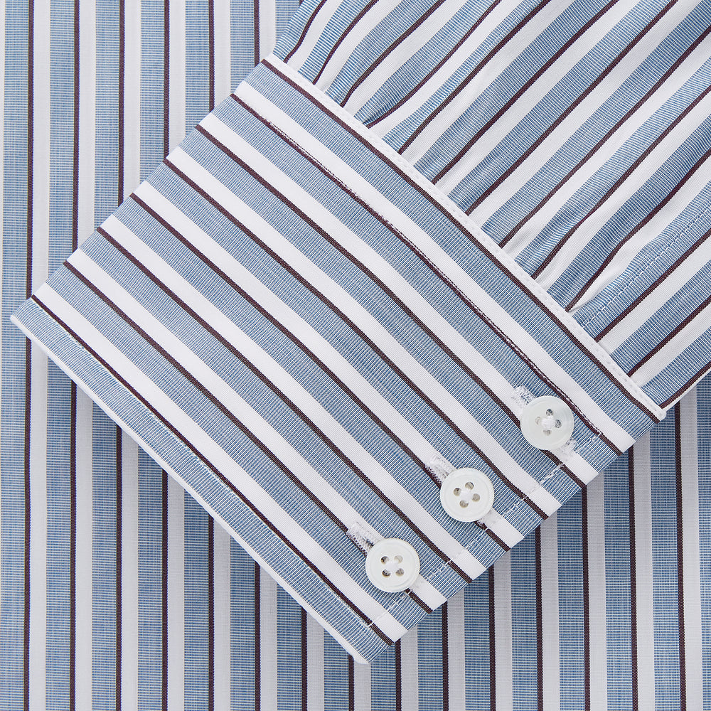 The Turnbull & Asser Blue and White Stripe Cotton Regular Fit Mayfair Shirt features long sleeves, a button-up front, collar, buttoned cuffs, and vertical stripes, shown on a white background.