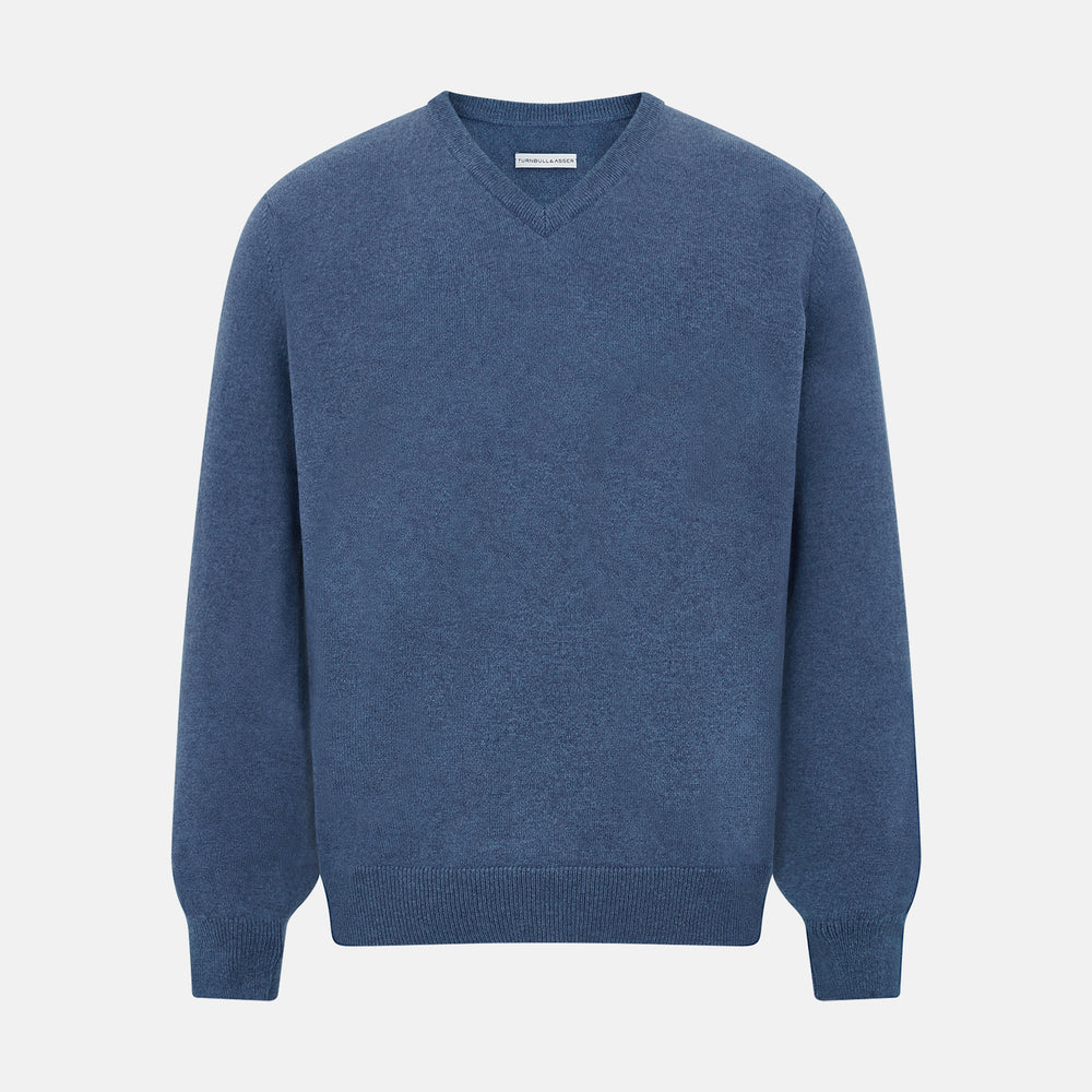 Turnbull & Asser’s Pacific Blue Cashmere V-Neck Jumper features ribbed cuffs, hem, and neckline, shown on a white background.