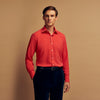 View 2 of product The Turnbull & Asser Coral Pink Silk Regular Fit Mayfair Shirt features long sleeves, a classic collar, and white buttons, displayed laid flat on a plain white background.