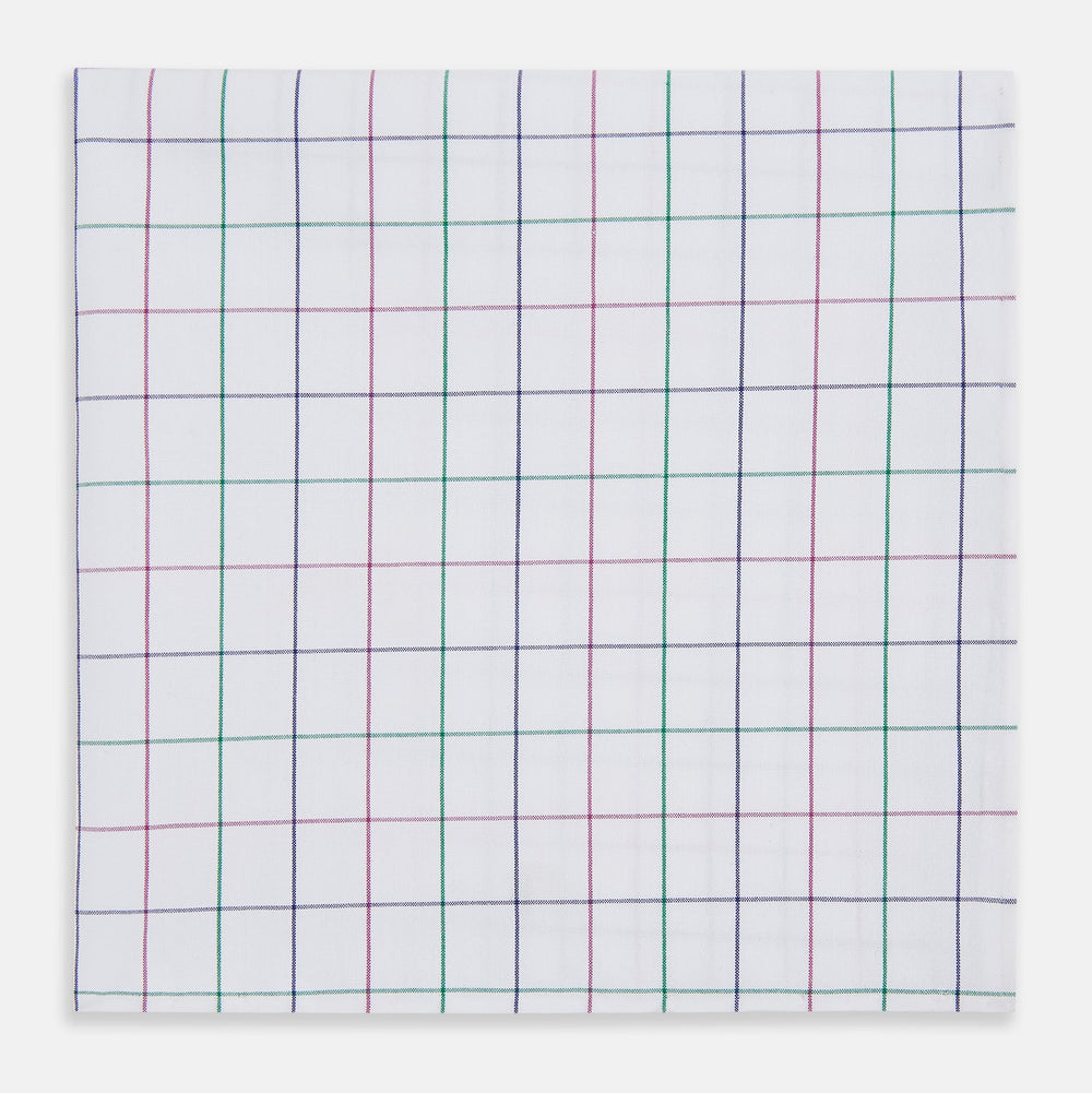 The Turnbull & Asser Hand Rolled Pink and Green Grid Check Handkerchief is a refined accessory, featuring a pink and green grid pattern—perfect for subtly enhancing any gentleman’s outfit.