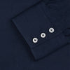 View 2 of product The Turnbull & Asser Navy Cotton Regular Fit Mayfair Shirt is a long-sleeved men’s formal shirt with a collar and white buttons, shown against a plain white background.