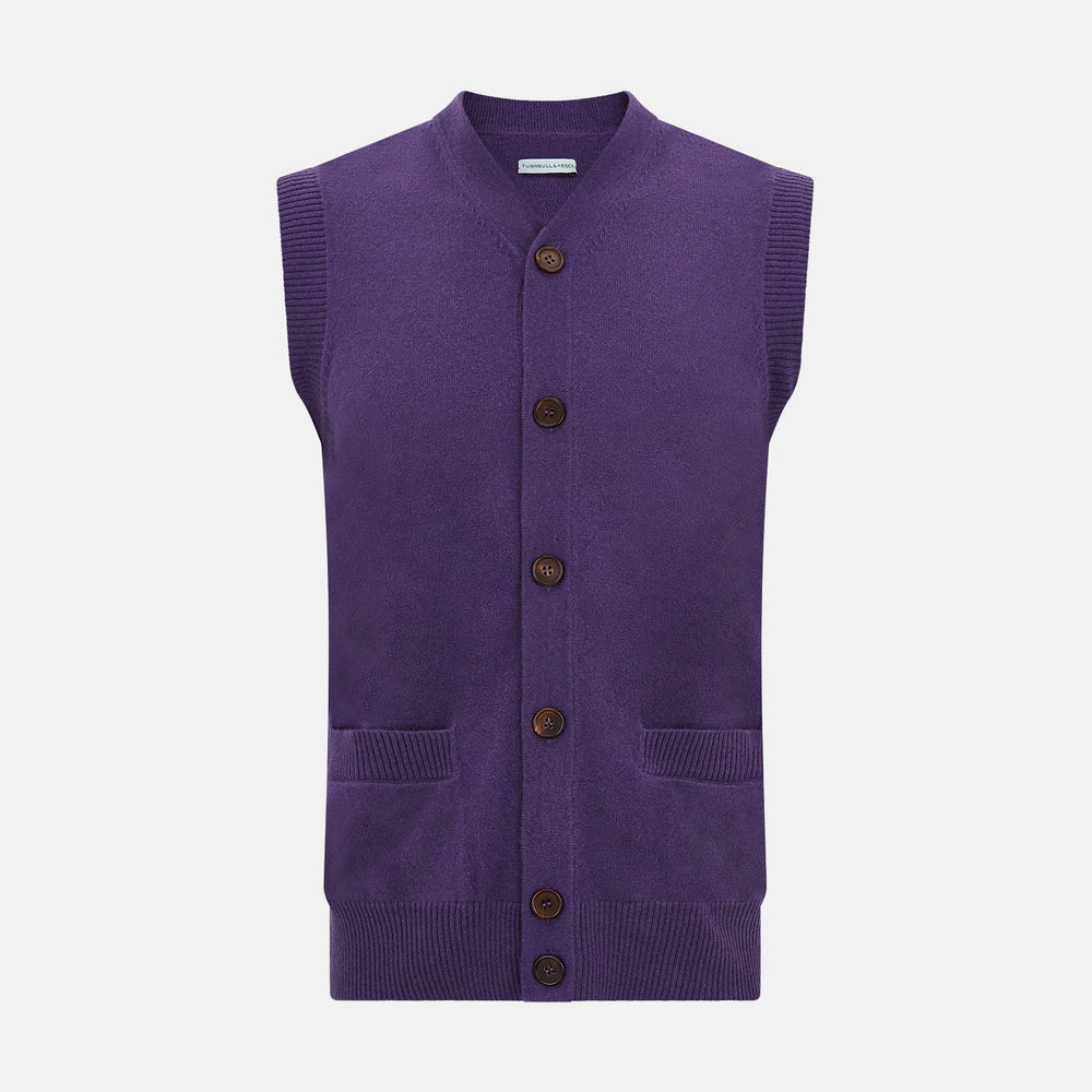 The Turnbull & Asser Purple Cashmere Sleeveless Cardigan features a V-neck, brown buttons, front pockets, and ribbed trim—an elegant, lightweight layer shown against a plain white background.