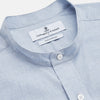 View 2 of product Turnbull & Asser’s Pale Blue Linen Blend Weekend Fit Unwin Shirt features long sleeves, a band collar, two chest pockets, and white buttons—ideal for casual summer wear.