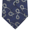 View 3 of product The Turnbull & Asser Navy Jacquard Silk Floral Tie features white and light blue abstract leaf designs, exemplifying fine British craftsmanship. Shown rolled up against a white background.
