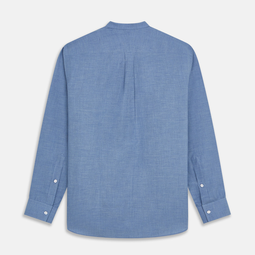 The Turnbull & Asser Blue Cotton Weekend Fit Blake Shirt features a light blue color, long sleeves, stand collar, white buttons, and a curved hem—ideal for casual weekends. Laid flat on a white background.