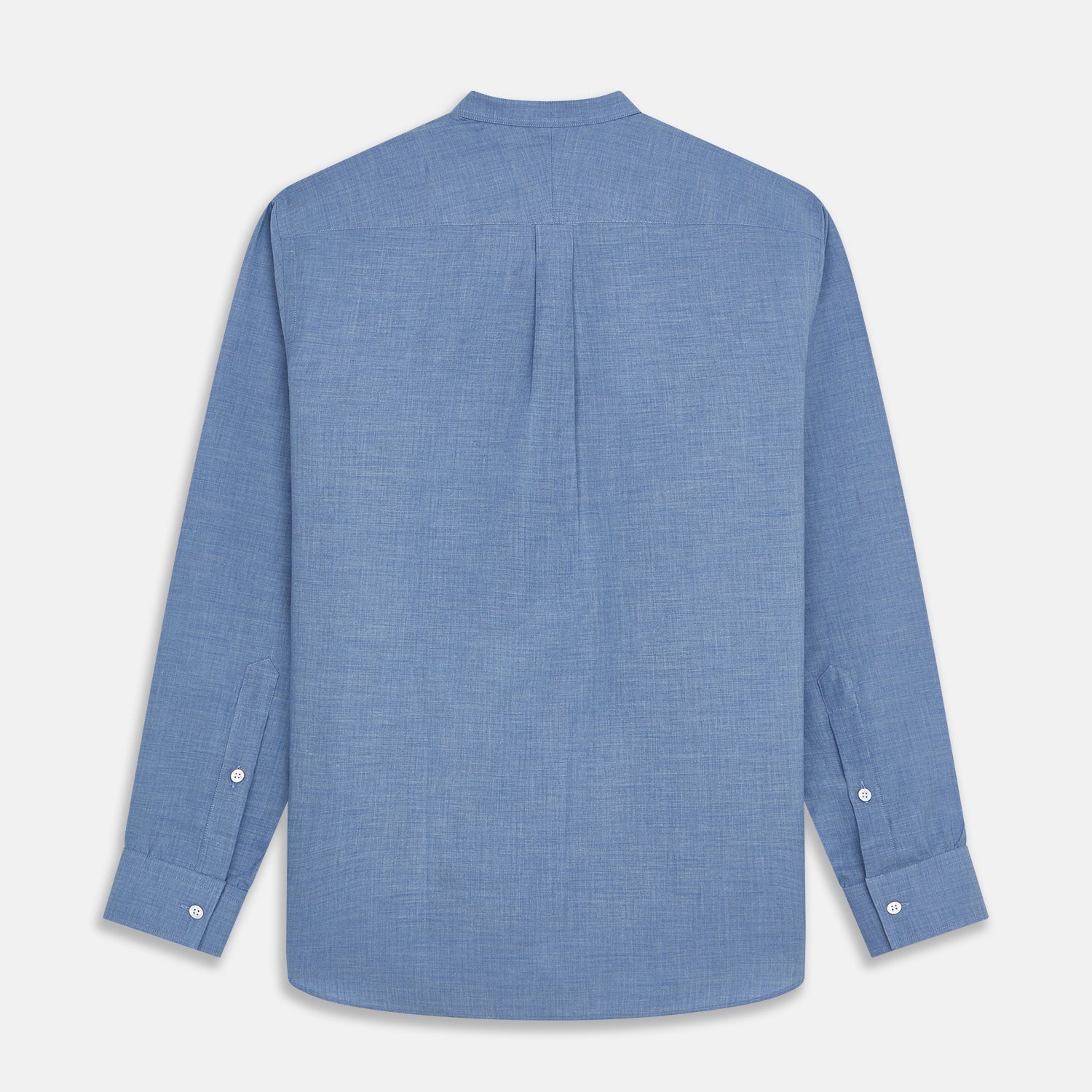 View 5 of product The Turnbull & Asser Blue Cotton Weekend Fit Blake Shirt features a light blue color, long sleeves, stand collar, white buttons, and a curved hem—ideal for casual weekends. Laid flat on a white background.