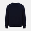 View 3 of product The Turnbull & Asser Navy Fine Merino V-Neck Cardigan features long sleeves, ribbed cuffs and hem, and is crafted from premium yarn for comfort and style, shown on a white background.