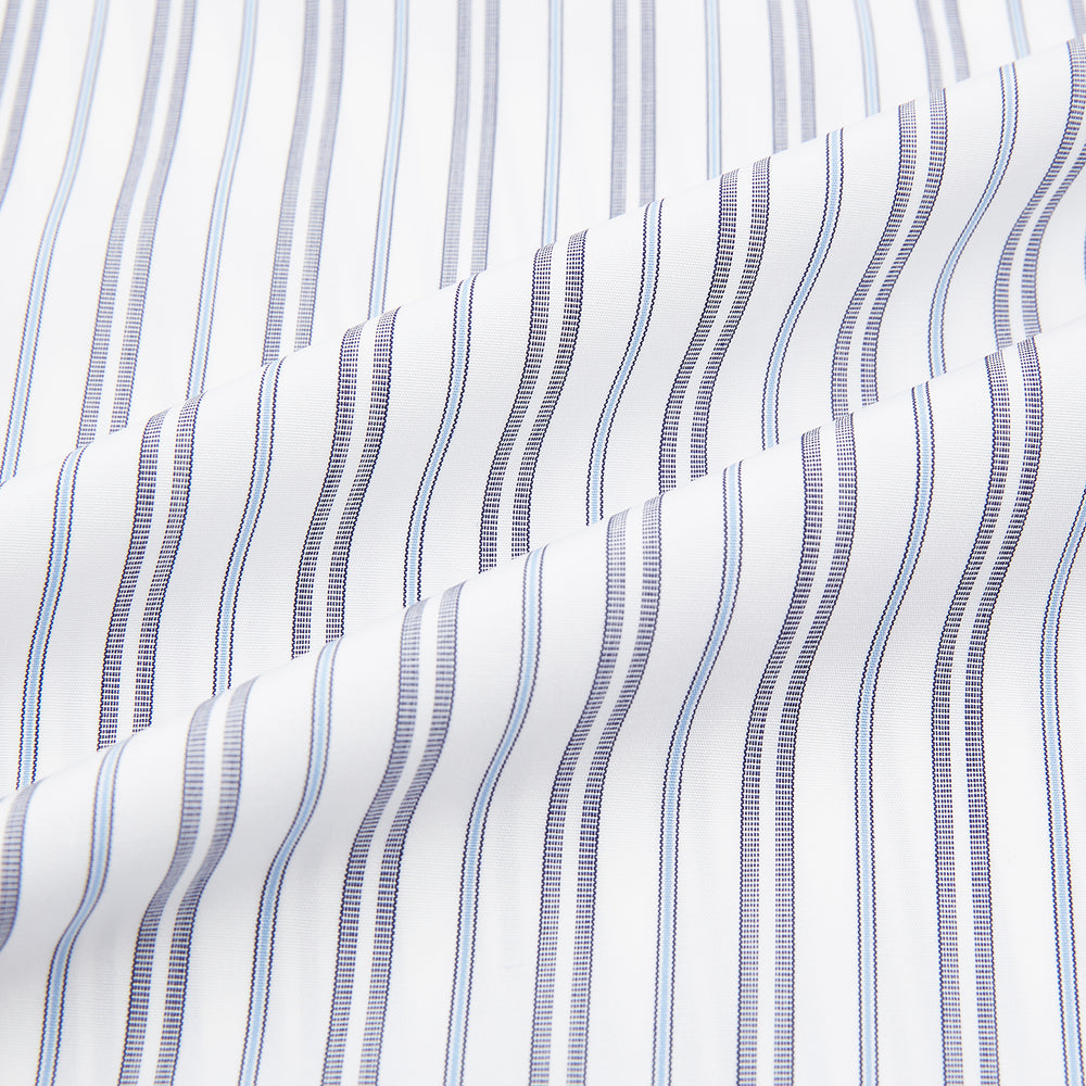 The Turnbull & Asser Navy Multi Stripe Mayfair Shirt features a T&A collar and premium Italian cotton, with vertical blue and white stripes. It is shown neatly laid flat on a white background.