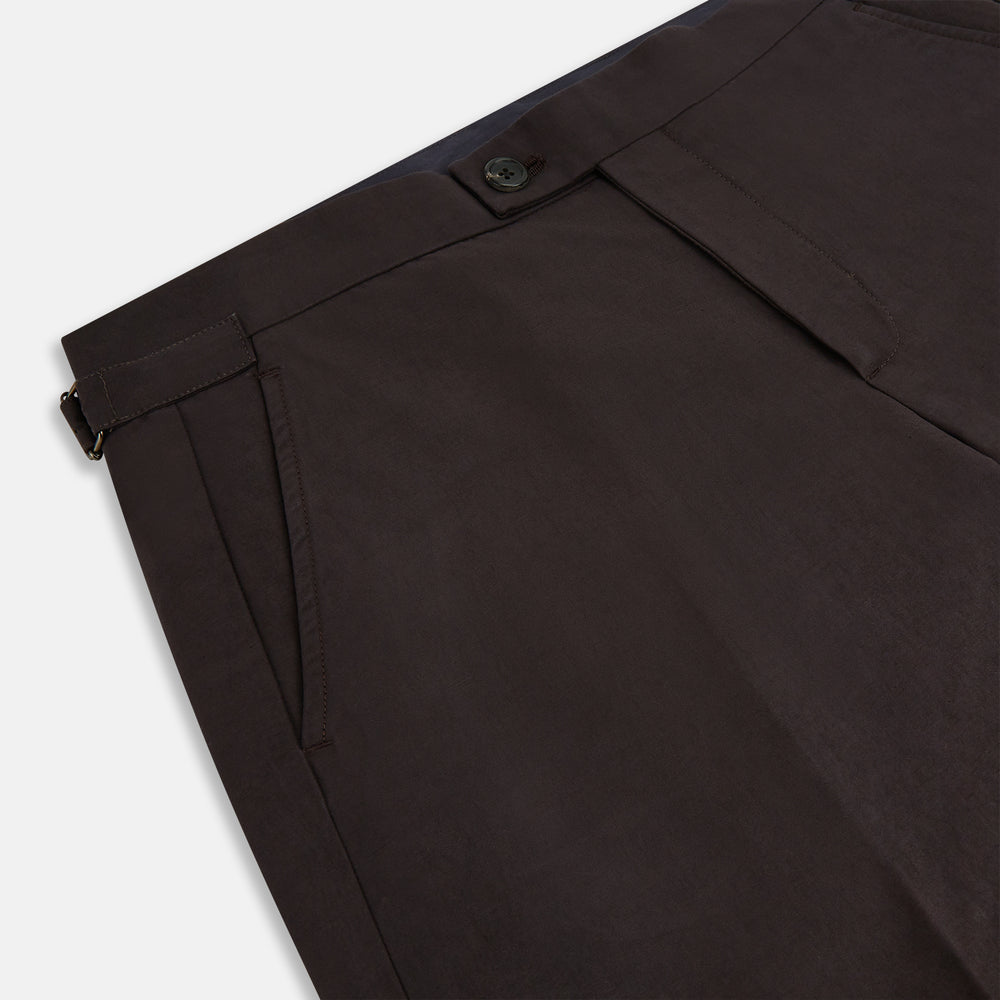 A pair of brown linen Henry trousers by Turnbull & Asser with a straight-leg cut and button waistband, ideal for formalwear, displayed against a plain white background.