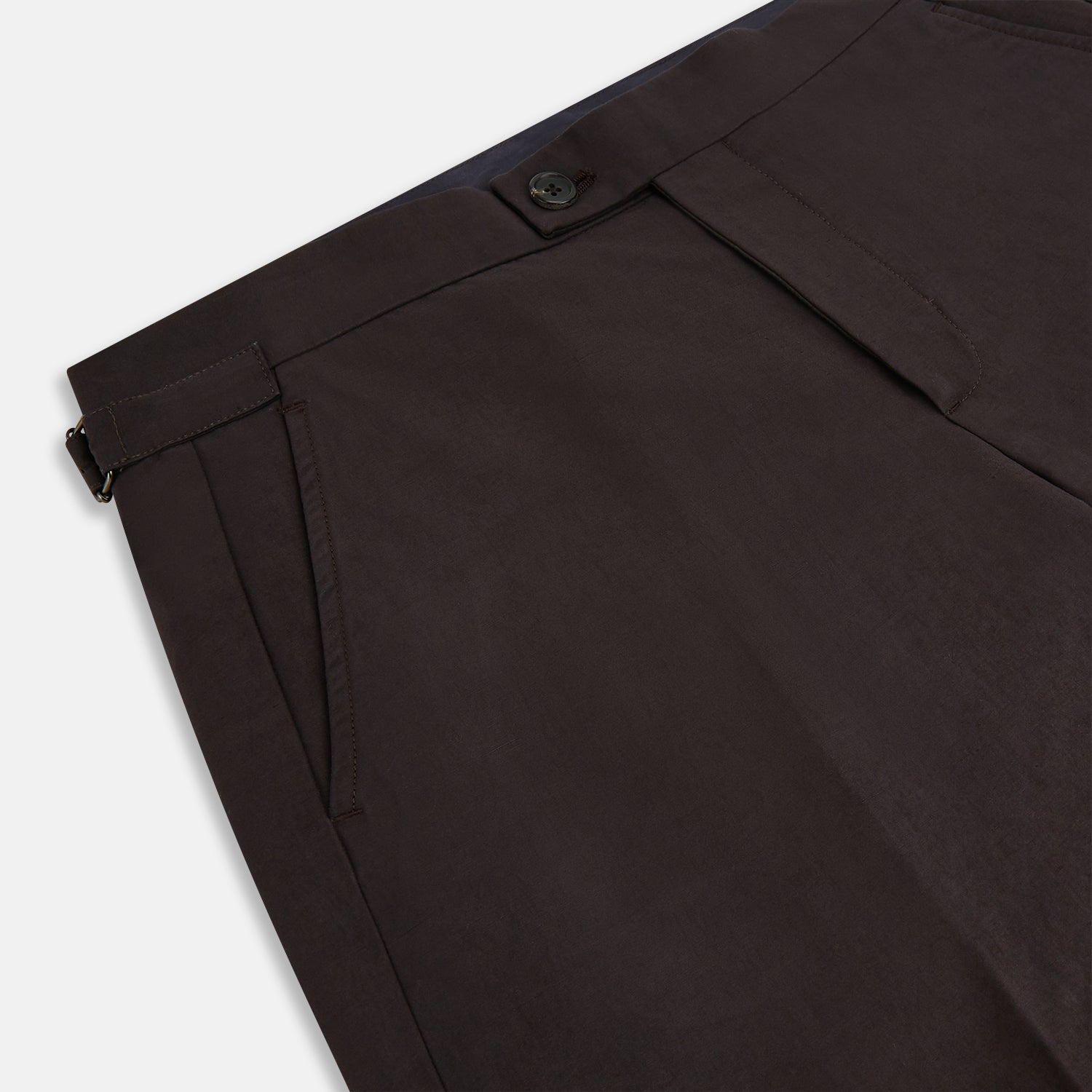 View 10 of product A pair of brown linen Henry trousers by Turnbull & Asser with a straight-leg cut and button waistband, ideal for formalwear, displayed against a plain white background.