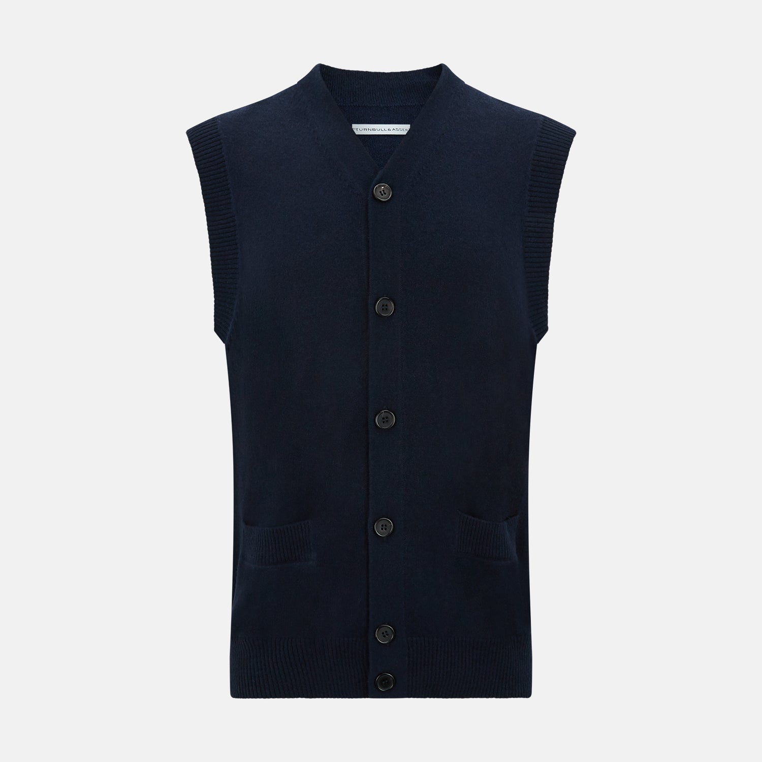 View 1 of product The Turnbull & Asser Navy Cashmere V-neck Sleeveless Cardigan features a button-up closure and two front pockets, ideal for elegant, gentleman-inspired looks, shown on a plain white background.