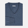 View 4 of product The Blue Melange Cashmere V-neck Jumper by Turnbull & Asser, featuring ribbed cuffs and hem, is part of our knitwear collection and shown against a white background.