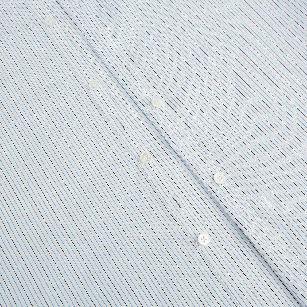 The Turnbull & Asser Pale Blue and Navy Pinstripe Westminster Shirt features long sleeves, a classic collar, and buttoned cuffs, highlighting British craftsmanship. The shirt is laid flat on a white background.