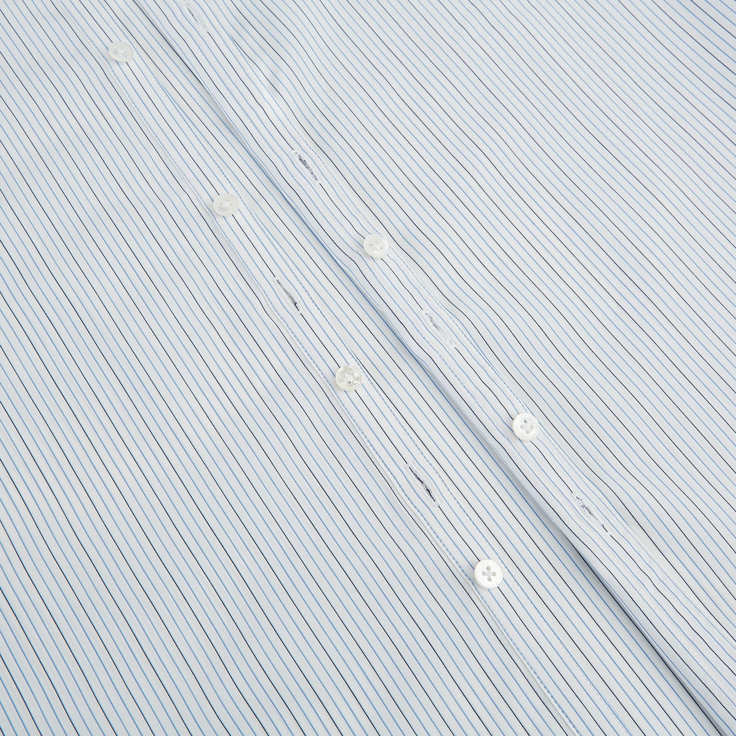 View 7 of product The Turnbull & Asser Pale Blue and Navy Pinstripe Westminster Shirt features long sleeves, a classic collar, and buttoned cuffs, highlighting British craftsmanship. The shirt is laid flat on a white background.