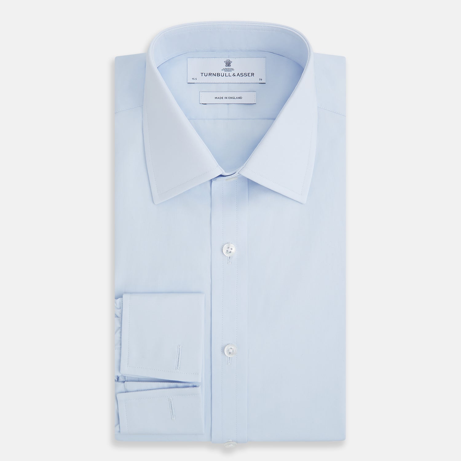 View 5 of product The Turnbull & Asser Light Blue Mayfair Shirt features white buttons, a classic collar, and buttoned cuffs—styled flat on a white background, it’s ideal for minimalist outfits or pairing with bold ties.
