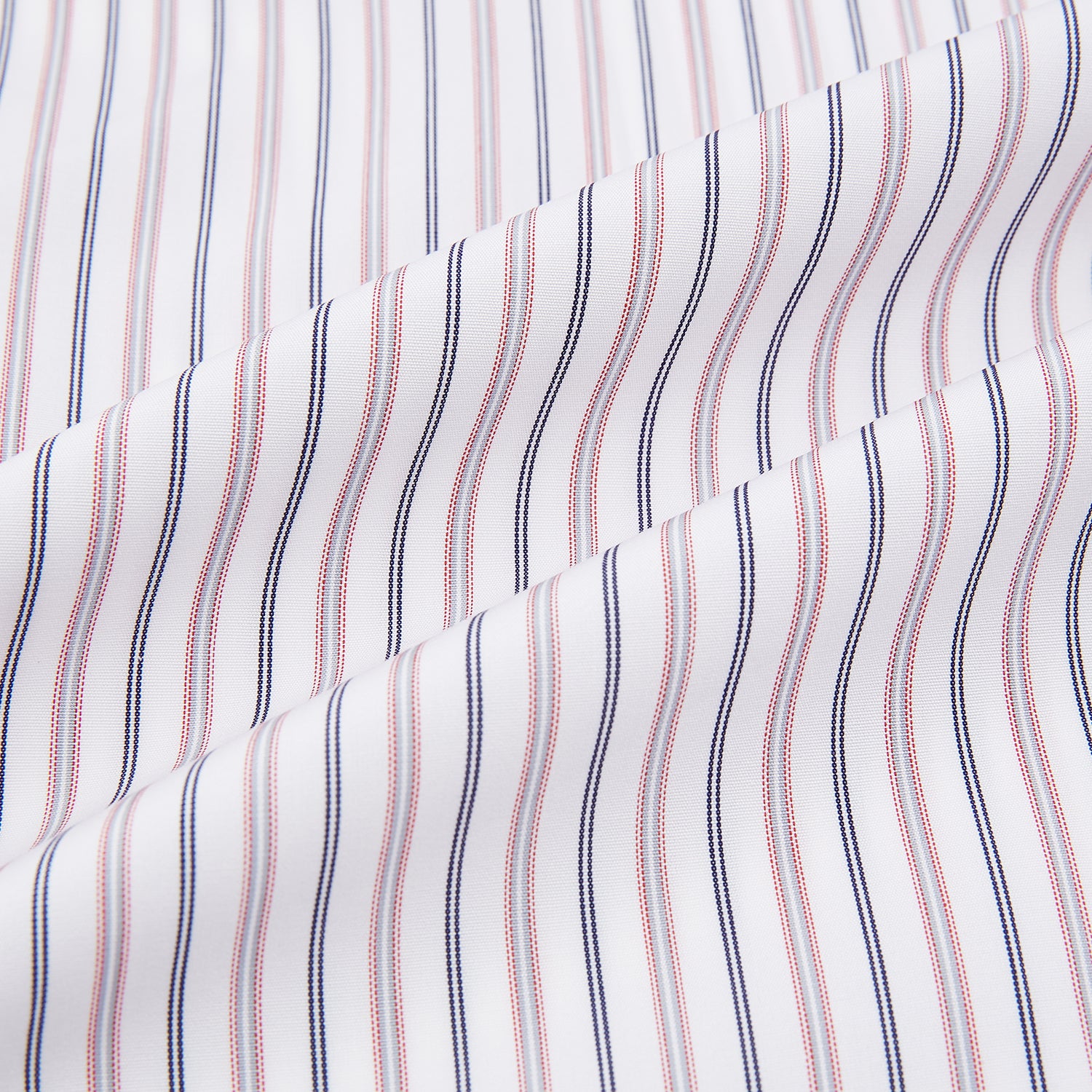 View 6 of product The Turnbull & Asser Red Multi Stripe Mayfair Shirt is a long-sleeve, button-up classic with a sharp collar and vibrant red multi stripes—an essential men's piece shown against a white background.