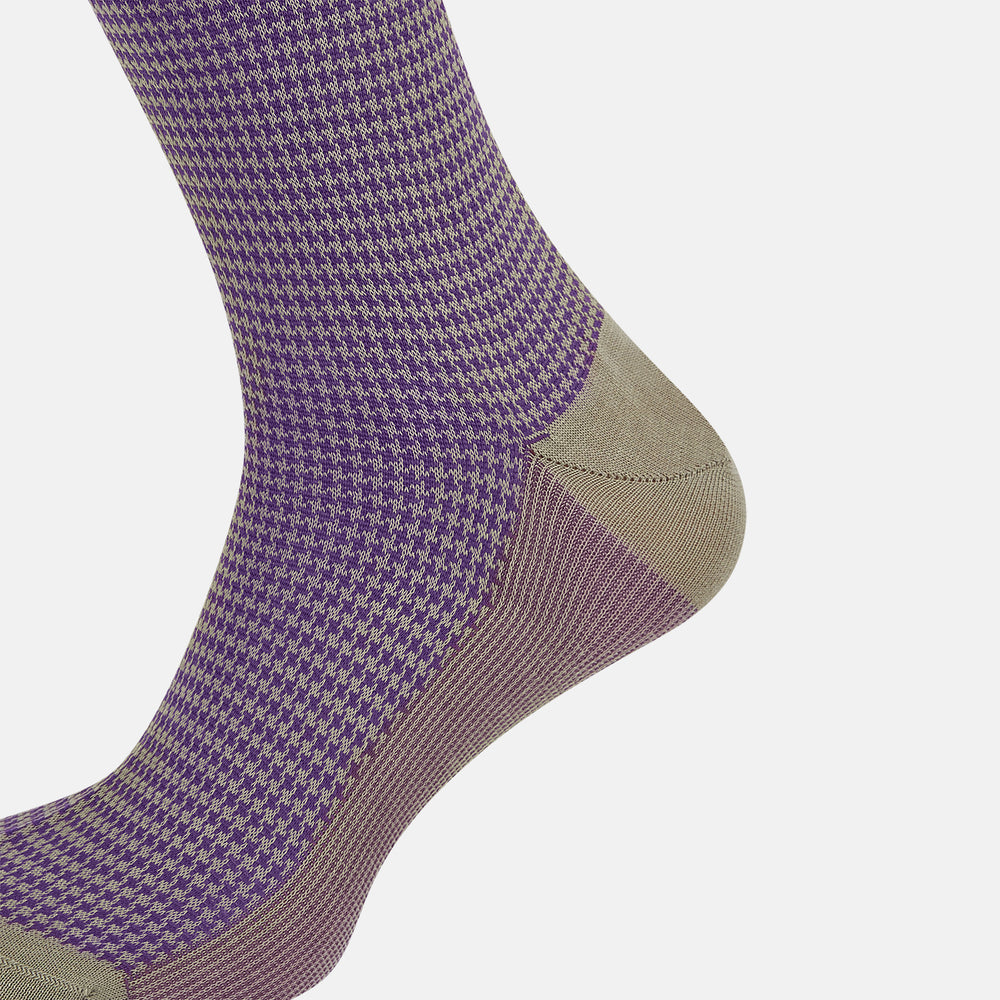 The Concrete Houndstooth Long Sock by Turnbull & Asser features a knee-high design with beige cuff, toe, and heel, plus a purple and black checkered pattern, shown on a plain white background.