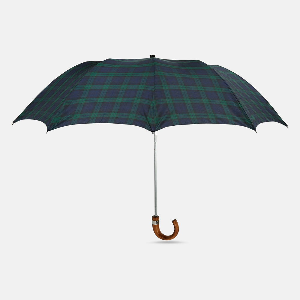 The Turnbull & Asser Black Watch Tartan Telescopic Umbrella features a green and blue plaid pattern and a whangee crook handle, offering classic luxury against a plain white background.