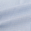 View 6 of product The Turnbull & Asser Blue Micro Graph Check Mayfair Shirt features long sleeves, a subtle check pattern, T&A collar, and buttoned cuffs, shown laid flat on a white background.