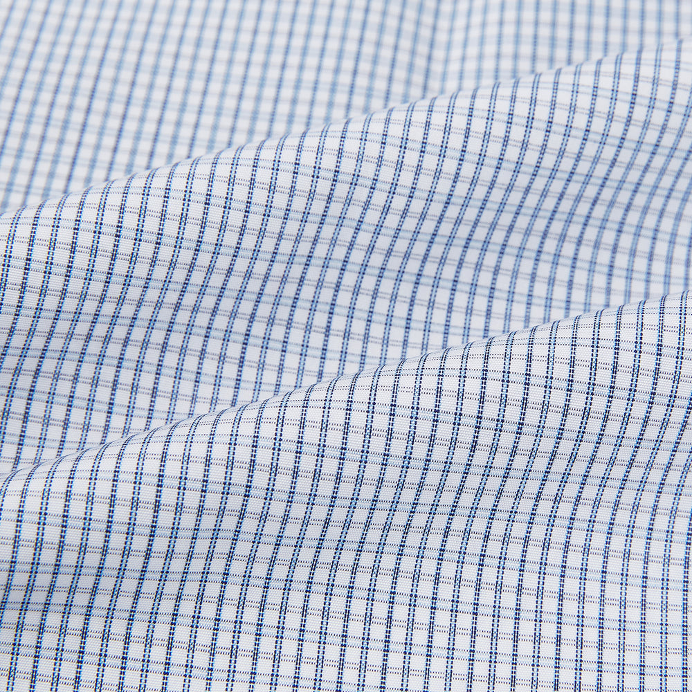 The Turnbull & Asser Blue Micro Graph Check Mayfair Shirt features long sleeves, a subtle check pattern, T&A collar, and buttoned cuffs, shown laid flat on a white background.