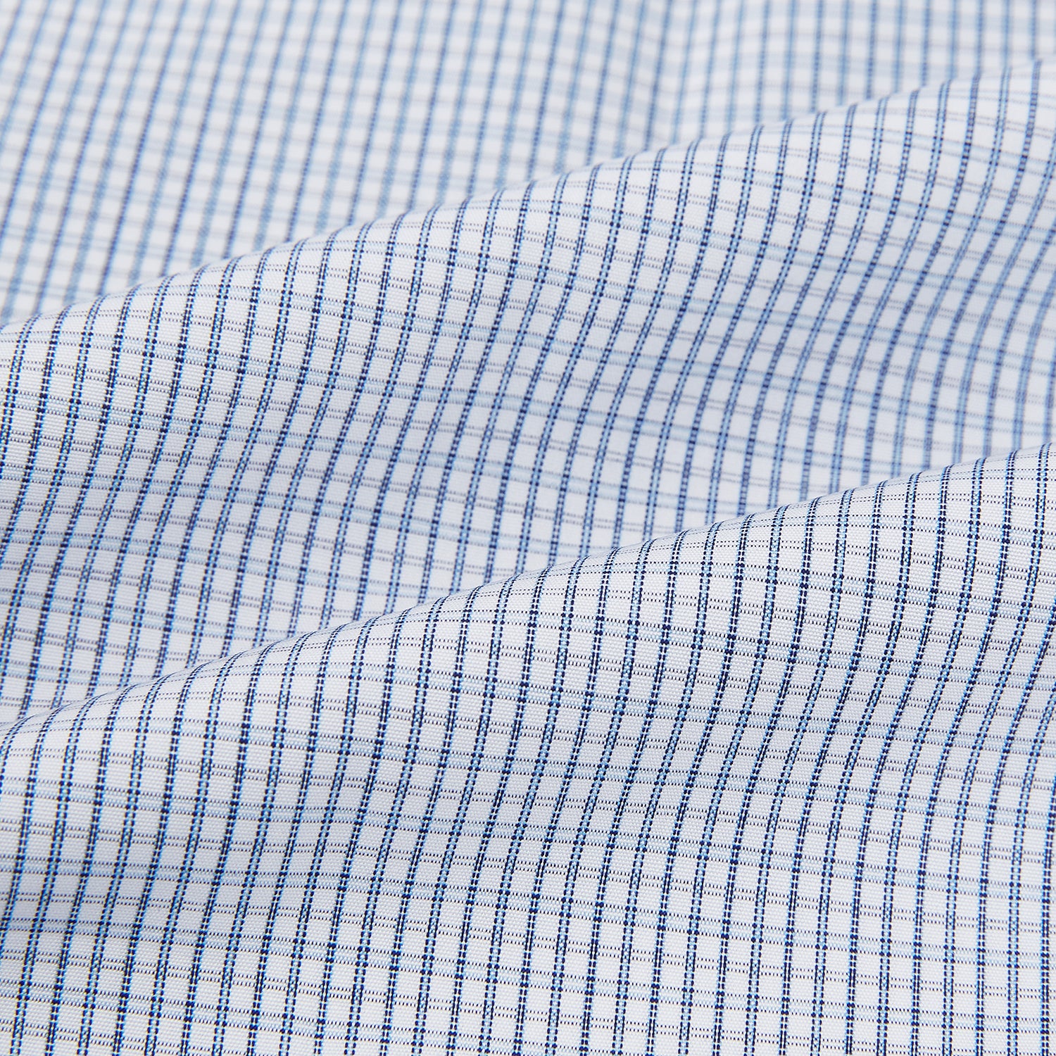 View 6 of product The Turnbull & Asser Blue Micro Graph Check Mayfair Shirt features long sleeves, a subtle check pattern, T&A collar, and buttoned cuffs, shown laid flat on a white background.