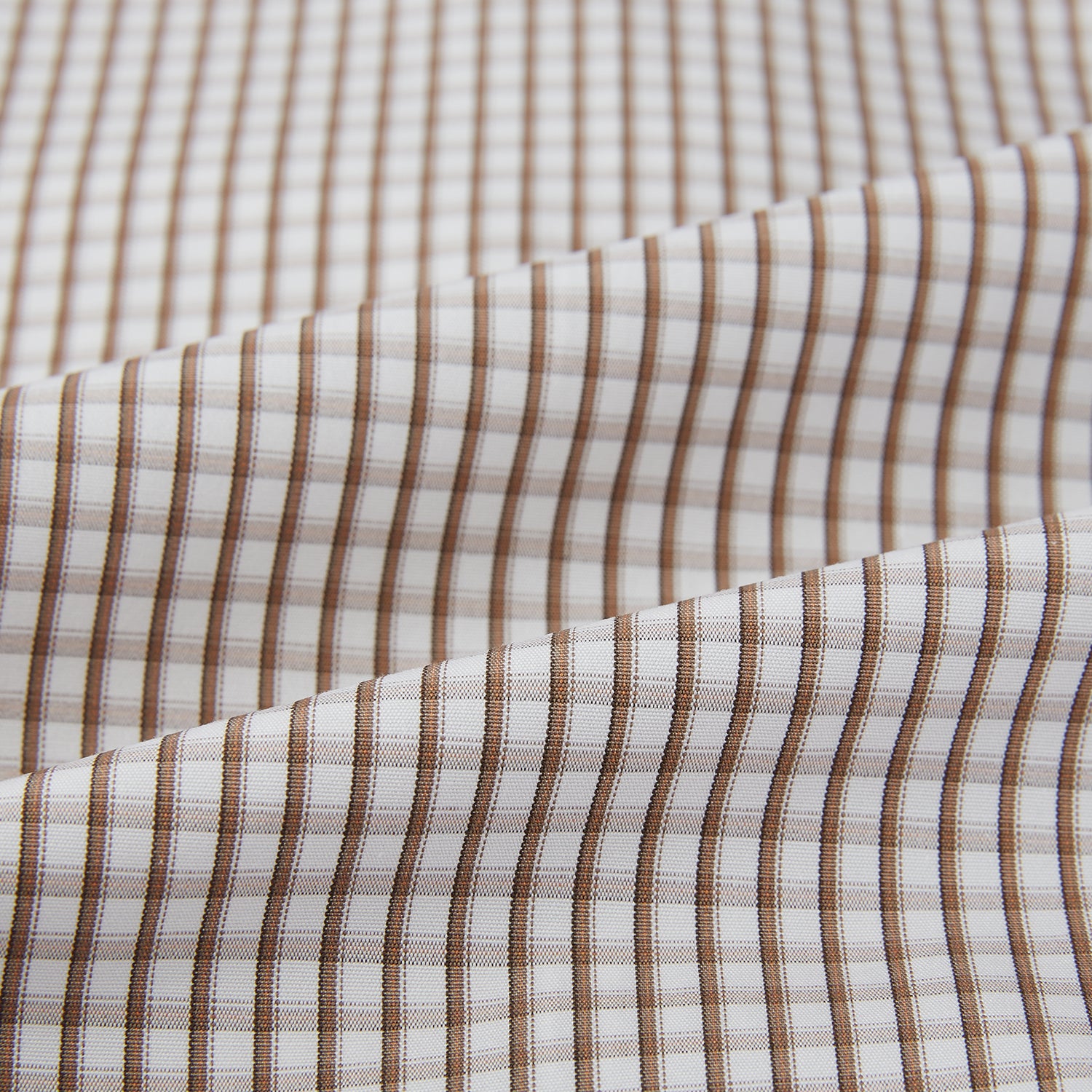 View 6 of product The Coffee Micro Shadow Check Mayfair Shirt by Turnbull & Asser is a long-sleeved, button-up shirt made from fine Italian cotton with a small brown and white check pattern, classic collar, and buttoned cuffs—an essential for any man’s wardrobe.