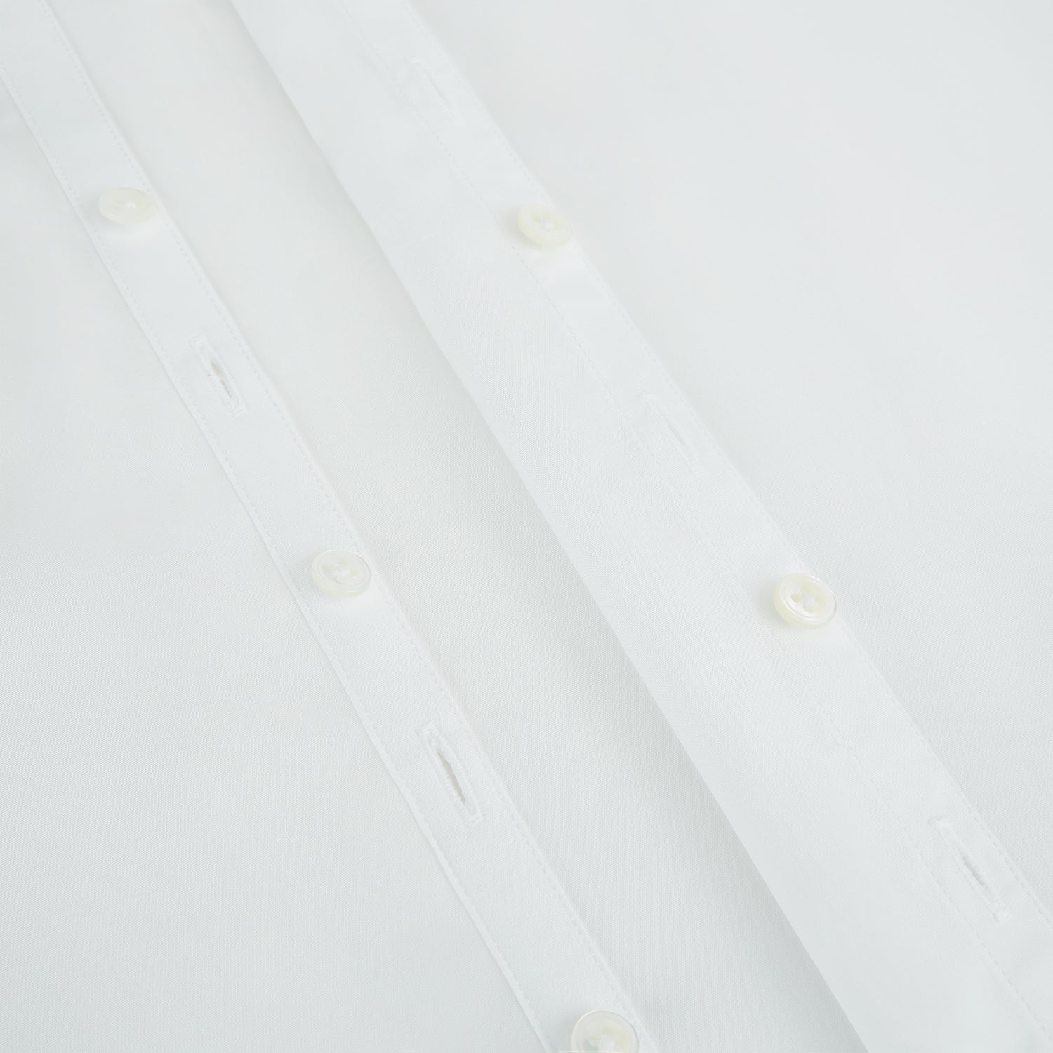 View 7 of product The PLAIN WHITE WESTMINSTER SHIRT WITH TURNBULL COLLAR AND 3-BUTTON CUFFS by Turnbull & Asser features refined British craftsmanship, long sleeves, a straight hem, and a crisp white design displayed on a plain background.