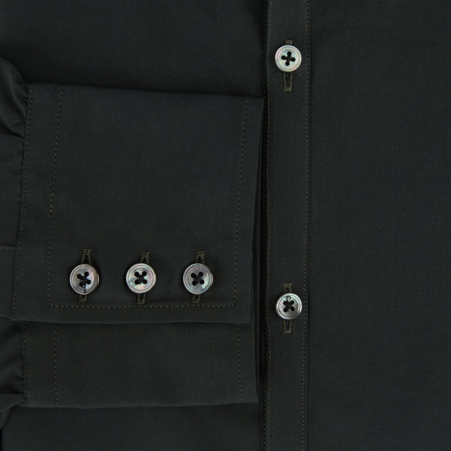 View 4 of product The FOREST GREEN WINDSOR SHIRT by Turnbull & Asser features long sleeves, a Windsor collar, and buttoned cuffs, reflecting British craftsmanship. Displayed on a plain white background.