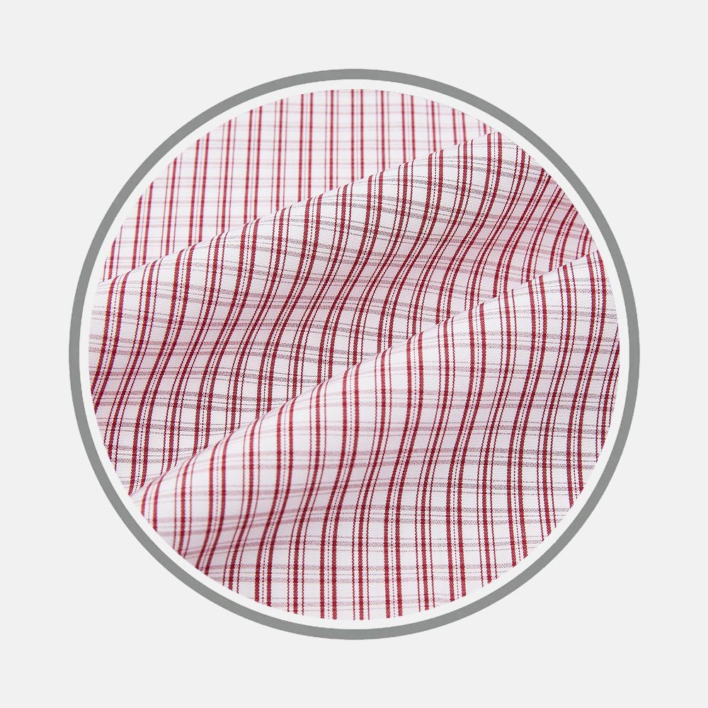 Close-up of Turnbull & Asser’s Red Micro Check Fabric, featuring a red checkered grid on white, shown in a circular frame against light gray. The fine lines create evenly spaced squares across the fabric.