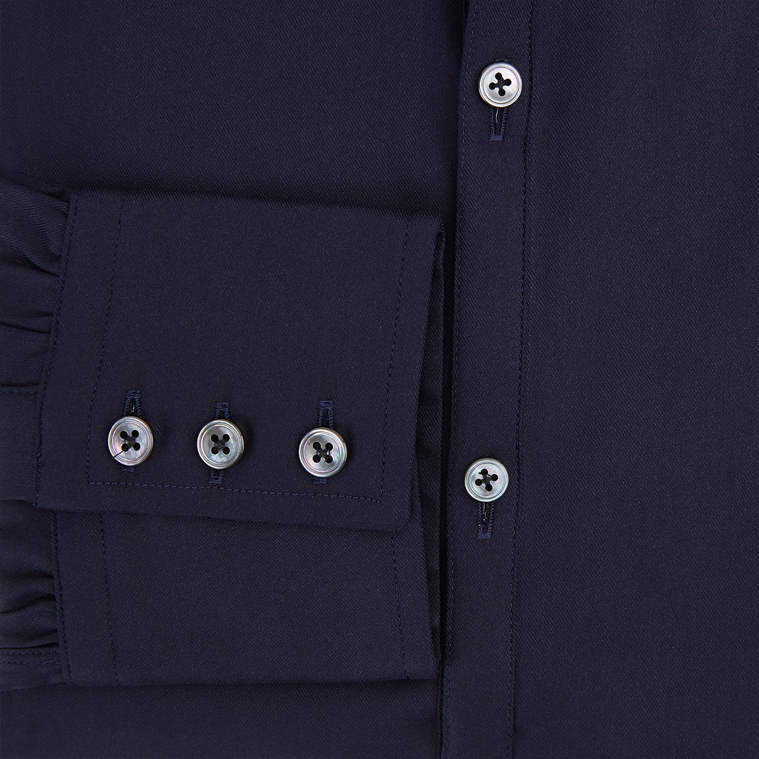 View 4 of product The Navy Twill Windsor Shirt by Turnbull & Asser features long sleeves, a button-up front, British craftsmanship, and a refined Windsor collar, shown in dark navy on a plain white background.