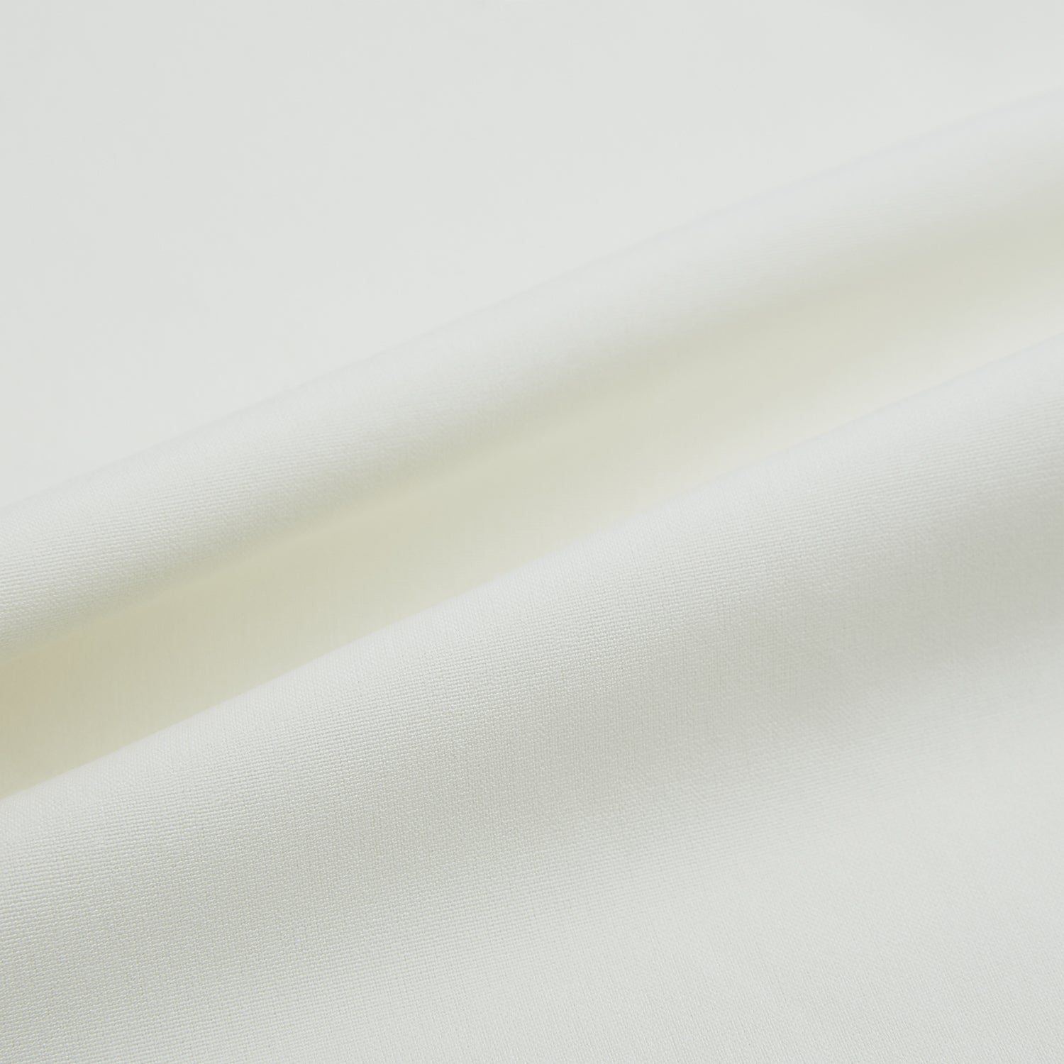 View 7 of product The Turnbull & Asser Cream Silk Pyjama Set, shown laid flat on a white background, features a long-sleeve button-up top with a chest pocket and matching pants with an elastic drawstring waist—ideal for comfortable loungewear.