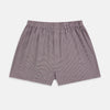 View 1 of product The Turnbull & Asser Burgundy Houndstooth Godfrey Boxer Shorts are luxury men's underwear made from Italian cotton, featuring an elastic waistband and a small maroon and white houndstooth pattern.