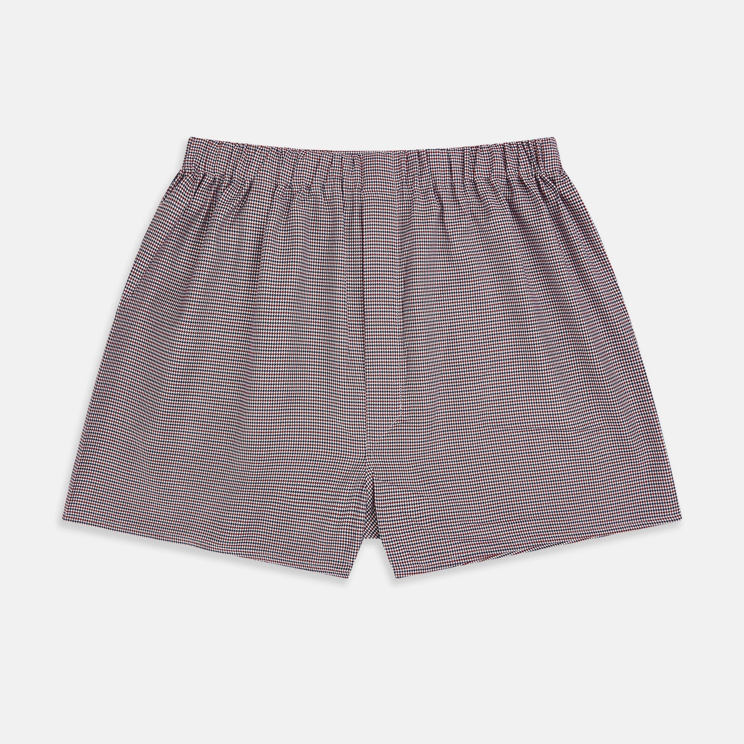 View 1 of product The Turnbull & Asser Burgundy Houndstooth Godfrey Boxer Shorts are luxury men's underwear made from Italian cotton, featuring an elastic waistband and a small maroon and white houndstooth pattern.