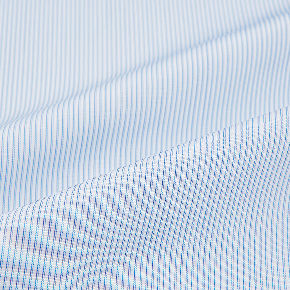 Turnbull & Asser Sky Blue Hairline Multi Stripe Shirt features a contrasting T&A collar and cuffs, long sleeves, and button-down front. Displayed against a plain white background.