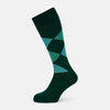 View 1 of product The Olive Check Mid-Length Socks by Turnbull & Asser, crafted from comfortable cotton in dark green with blue and light green argyle patterns, are shown on a plain white background—ideal for adding stylish flair to your sock collection.