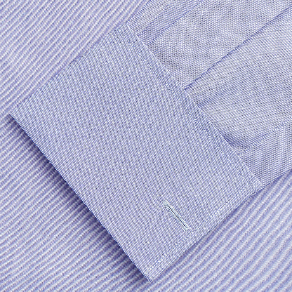 The Turnbull & Asser Tailored Fit Blue End-on-End Cotton Shirt features a Kent collar, double cuffs, and sleek white buttons—an ideal match for a navy suit to complete a sophisticated look. Displayed on a white background.