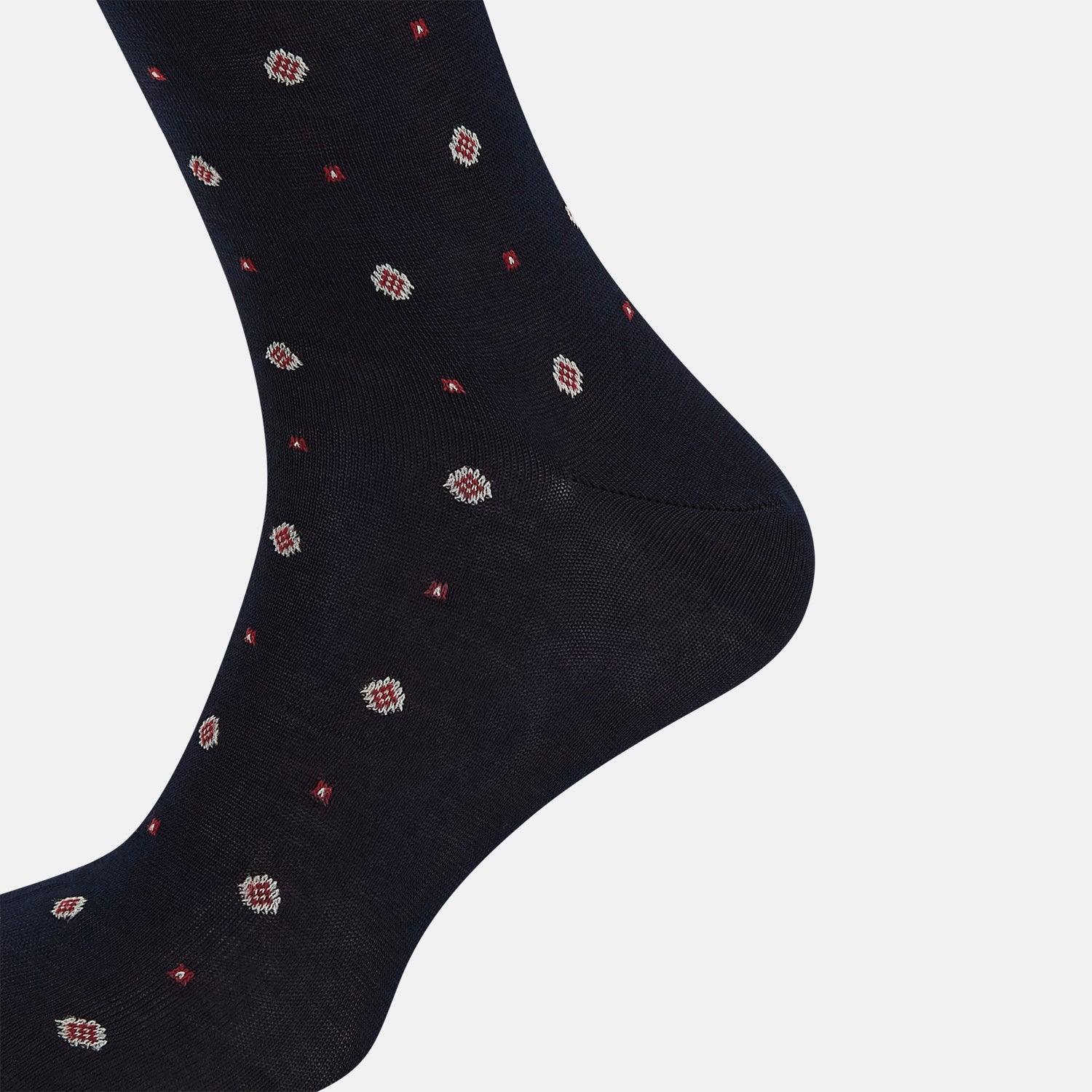 View 4 of product The Turnbull & Asser Midnight Patterned Mid-Length Sock features a ribbed cuff and a design of small white hexagons with red dots, shown here as a single sock on a plain white background.