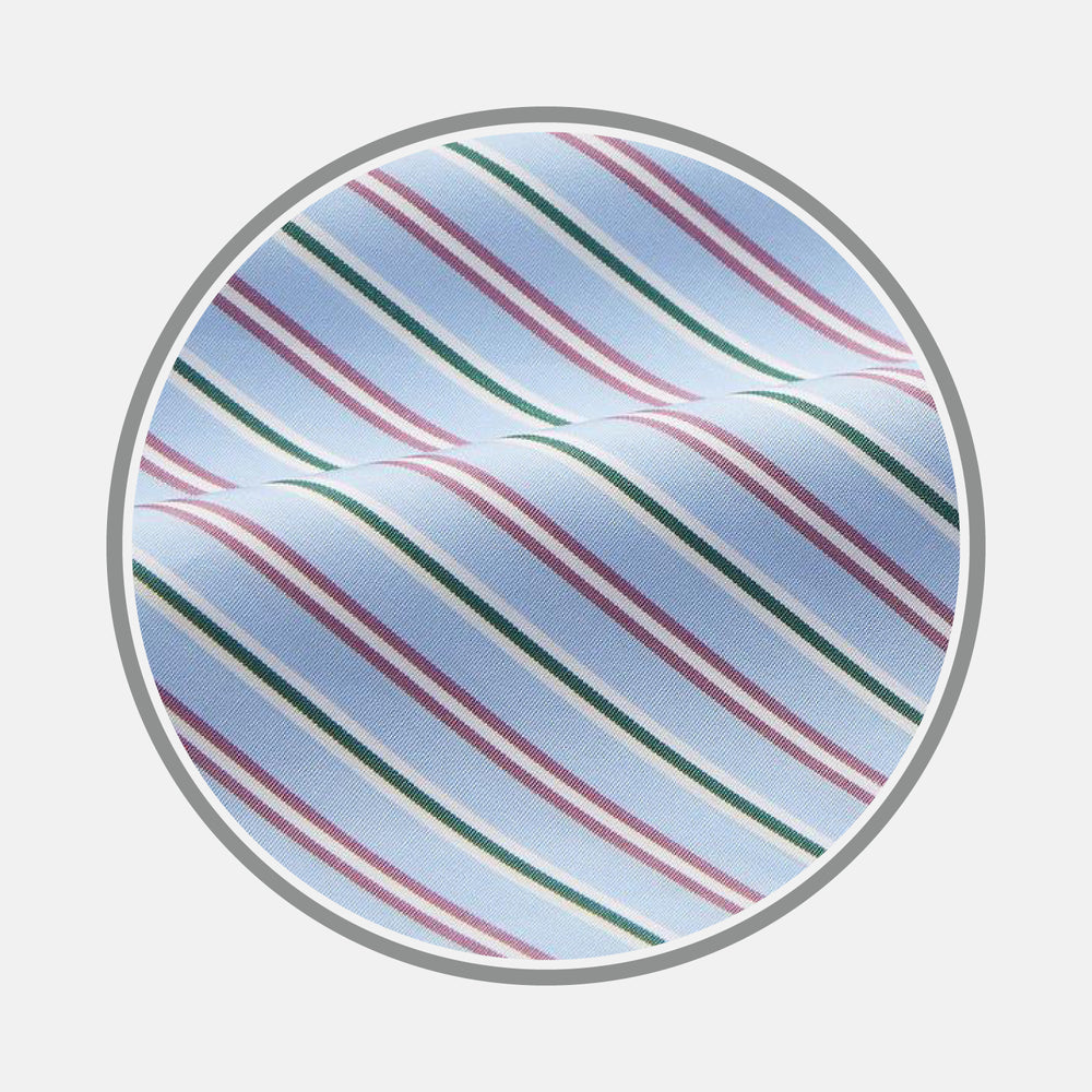 Close-up of Turnbull & Asser's Blue, Purple & Green Stripe Cotton Fabric featuring diagonal stripes on a light blue background, viewed through a circular frame; the cotton material is softly folded and slightly textured.