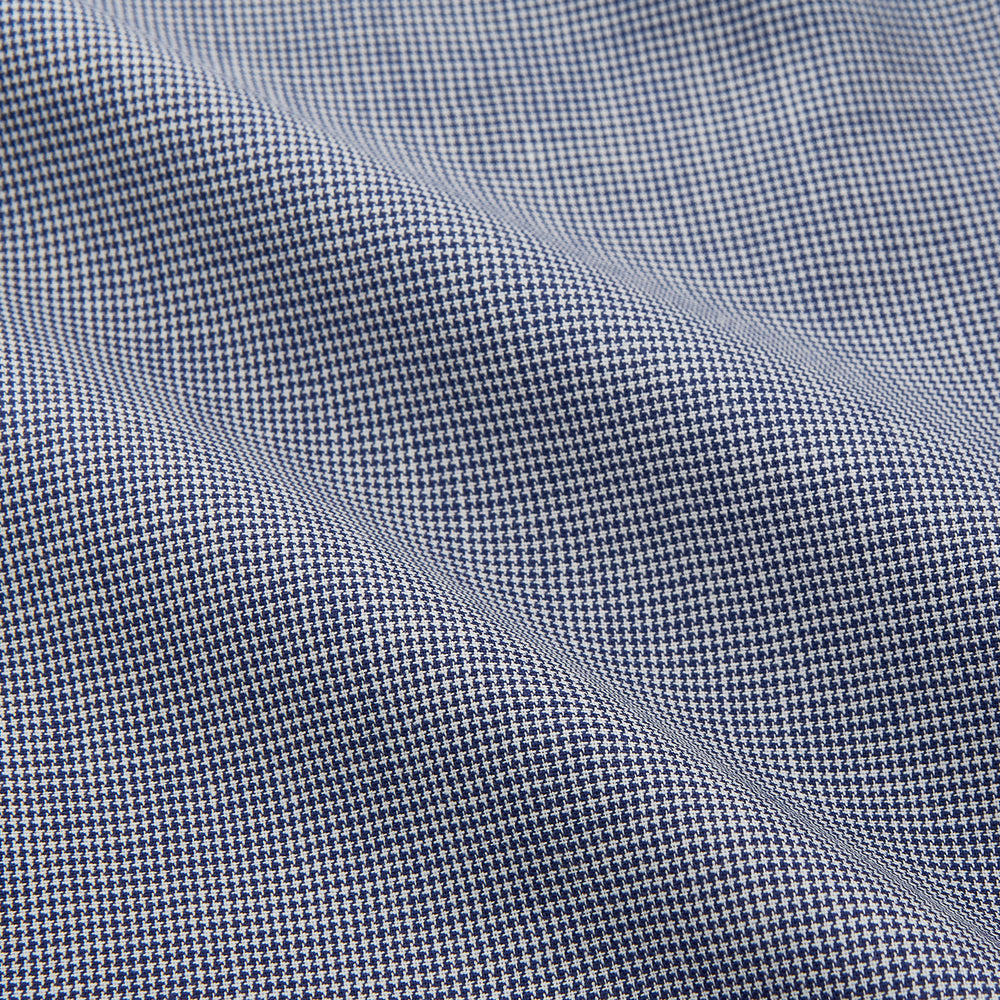 The Turnbull & Asser Navy Houndstooth Wool Tailored Fit Shelton Shirt features a classic collar, buttoned cuffs, and a refined tailored fit, shown laid flat on a white background.