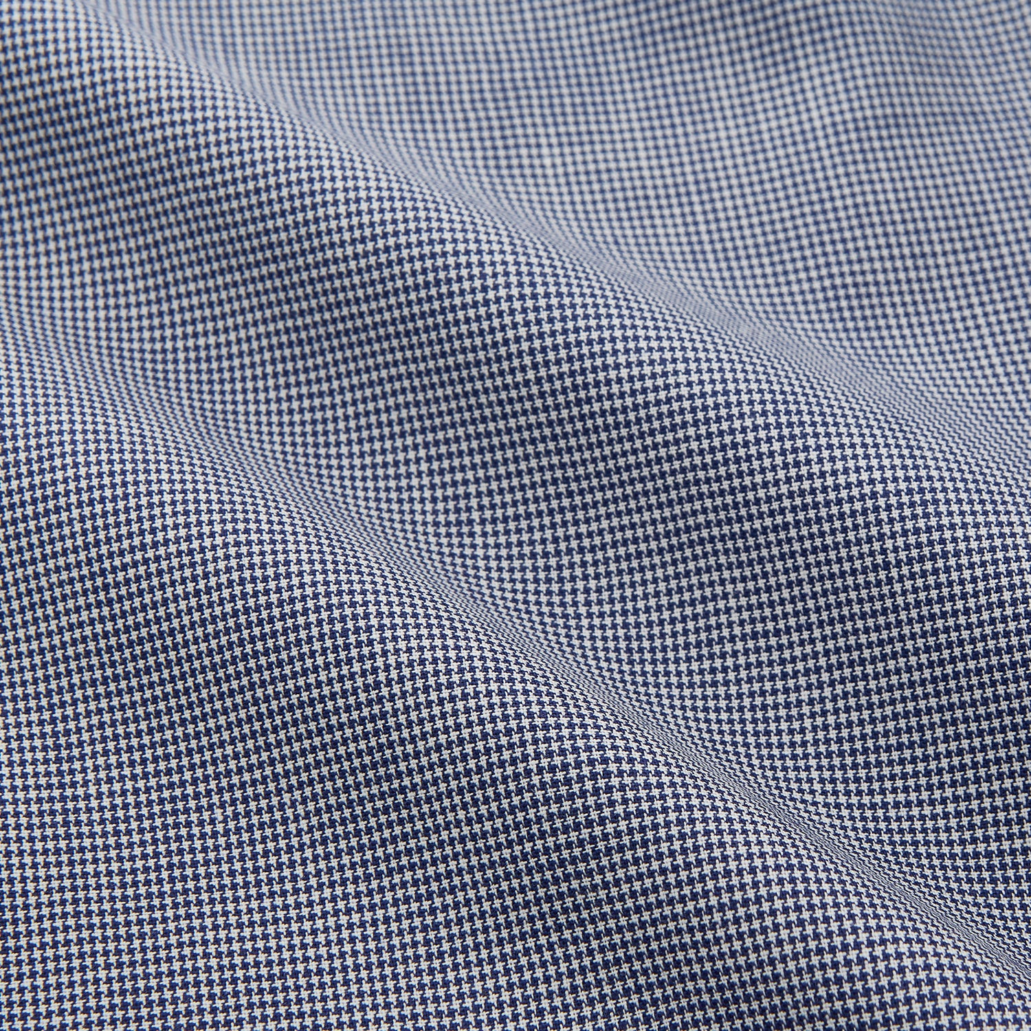 View 3 of product The Turnbull & Asser Navy Houndstooth Wool Tailored Fit Shelton Shirt features a classic collar, buttoned cuffs, and a refined tailored fit, shown laid flat on a white background.