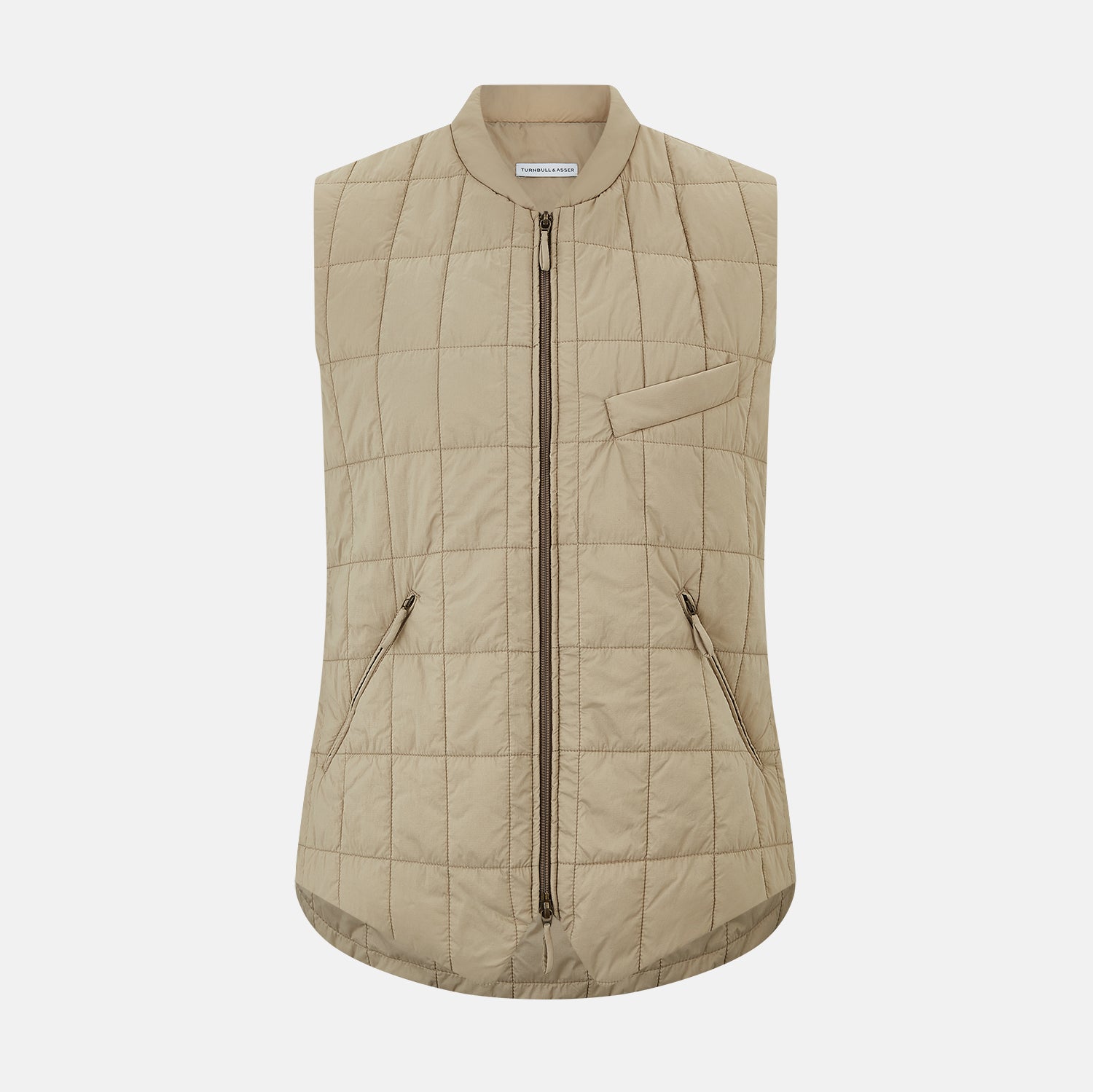 View 1 of product The Turnbull & Asser Sand Quilted Gilet is a beige, lightweight vest featuring a front zipper, two zippered side pockets, a chest pocket, and a rounded hem, shown against a white background.