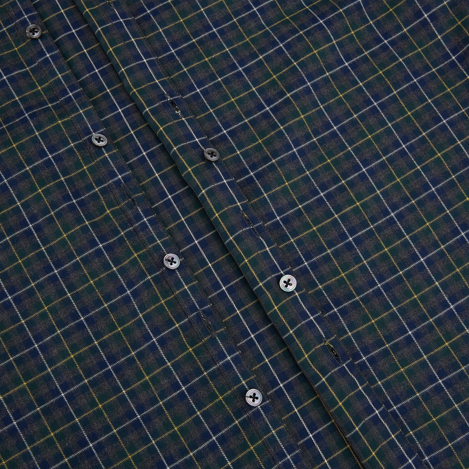 View 7 of product The Turnbull & Asser Navy and Khaki Tartan Windsor Shirt features a long-sleeve button-up design with a Windsor collar and buttoned cuffs, showcasing British craftsmanship in a classic tartan pattern.