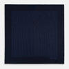View 3 of product The Navy Stripe Silk Pocket Square by Turnbull & Asser features a dark navy silk with thin light blue stripes and hand-rolled edges, folded to reveal both sides and “TURNBULL & ASSER HAND PRINTED IN ENGLAND” in the corner.