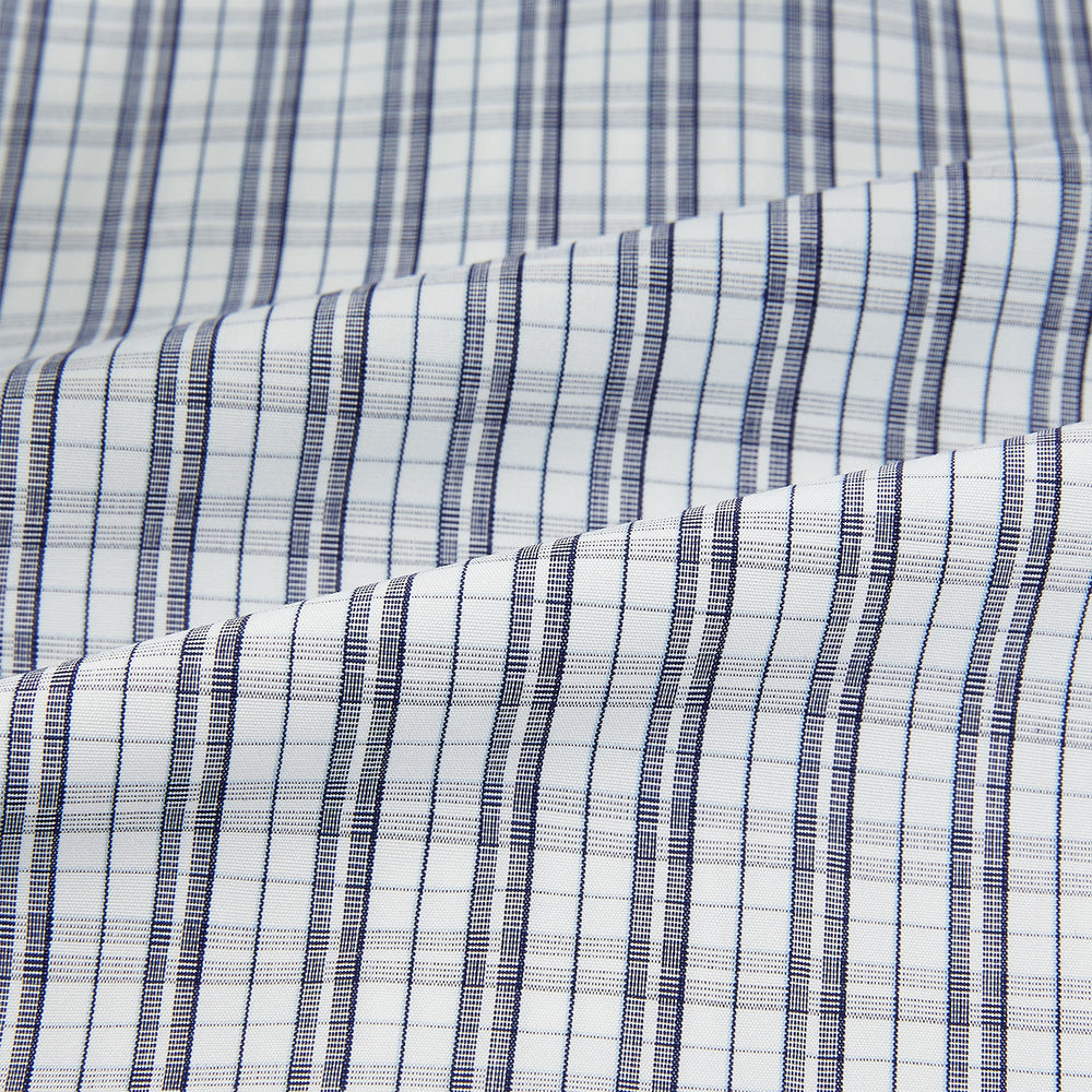 The Turnbull & Asser Navy Multi Check Mayfair Shirt is made from pure cotton with a blue and white check pattern, long sleeves, pointed collar, and buttoned cuffs, shown against a white background.