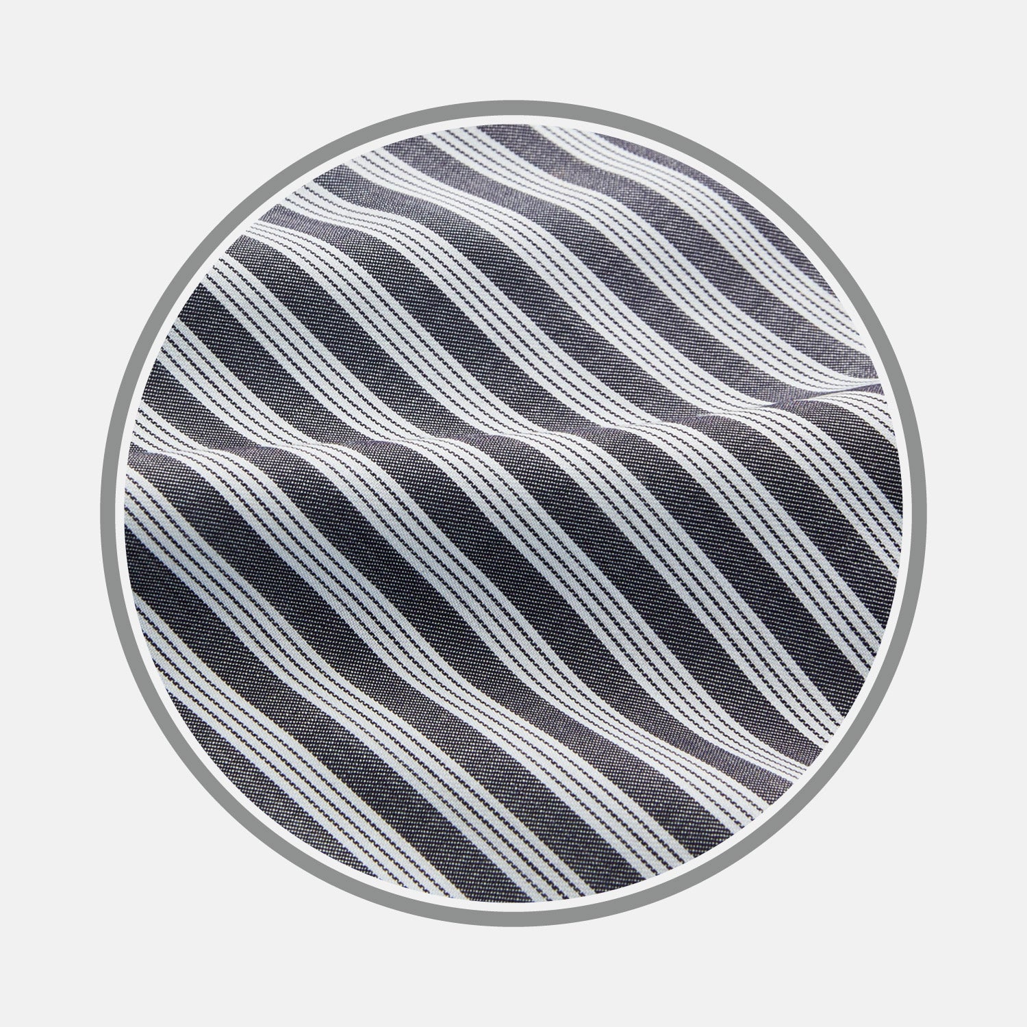 View 1 of product Close-up of Turnbull & Asser's Navy Multi Stripe Wool Fabric, featuring diagonal white stripes, displayed inside a circular frame on a light gray background.