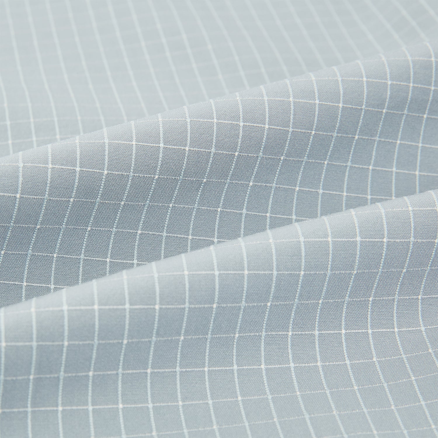 View 6 of product Turnbull & Asser Pale Blue Fine Check Mayfair Shirt—a long-sleeve button-up with classic collar, buttoned cuffs, white buttons, and a subtle check pattern in sanforised cotton—displayed on a white background.