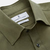 View 2 of product The Turnbull & Asser Green Silk Regular Fit Flaxton Shirt features long sleeves, a classic Bury collar, white buttons, and a straight hem, shown against a plain white background.